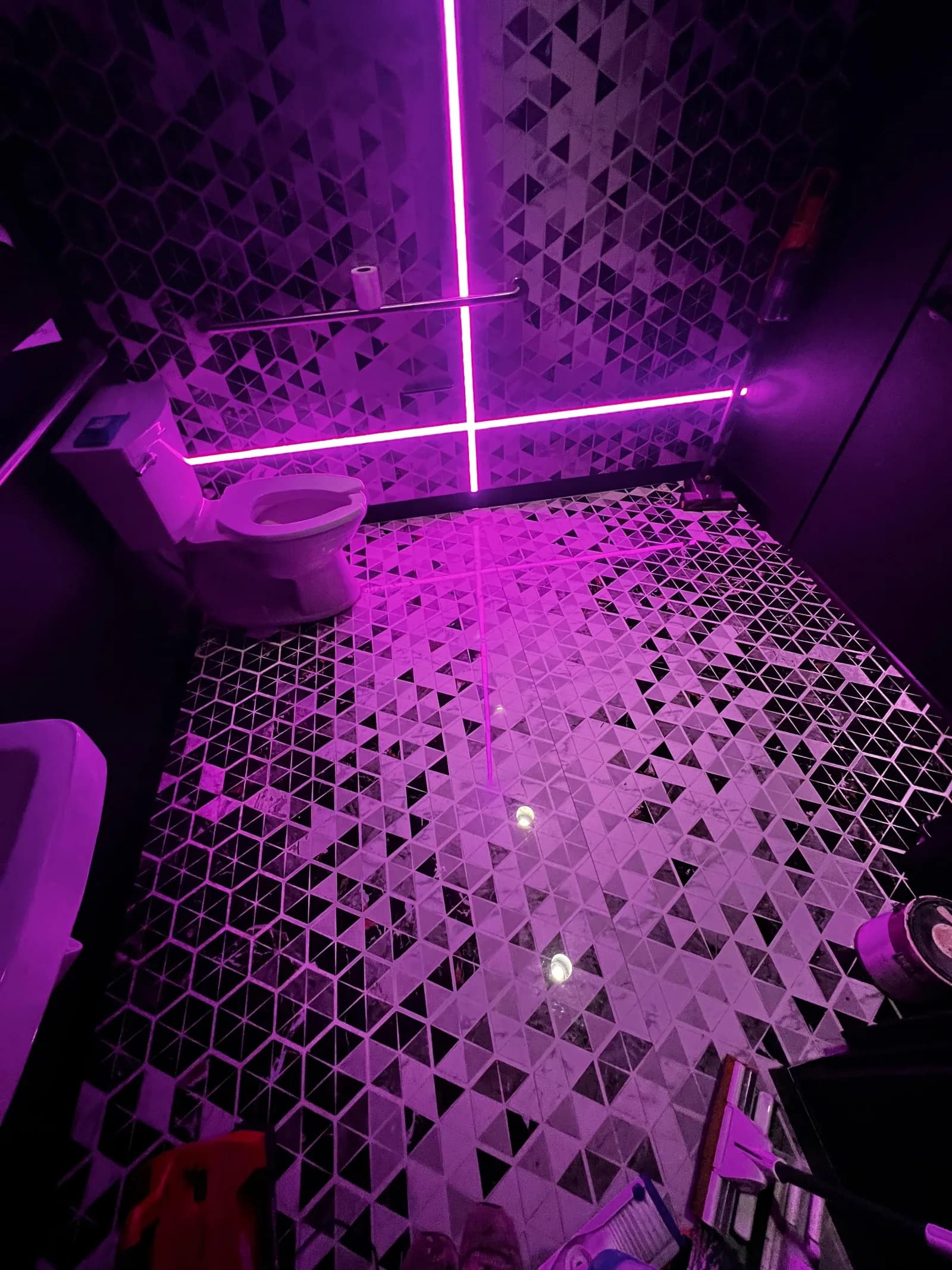 Geometric tile bathroom with neon LED accent lighting